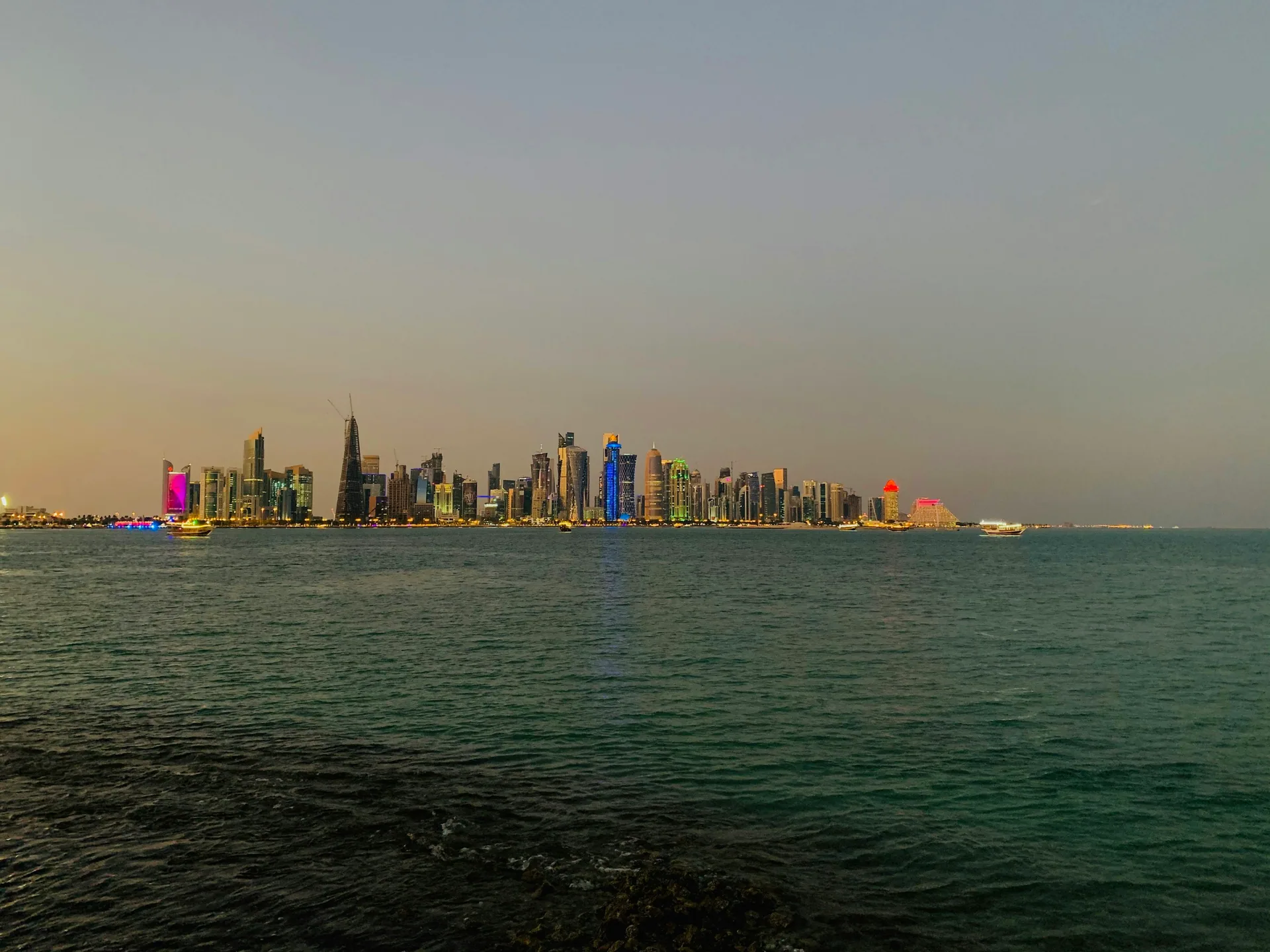 Doha skyline seen across the water from Al Corniche Street in Qatar