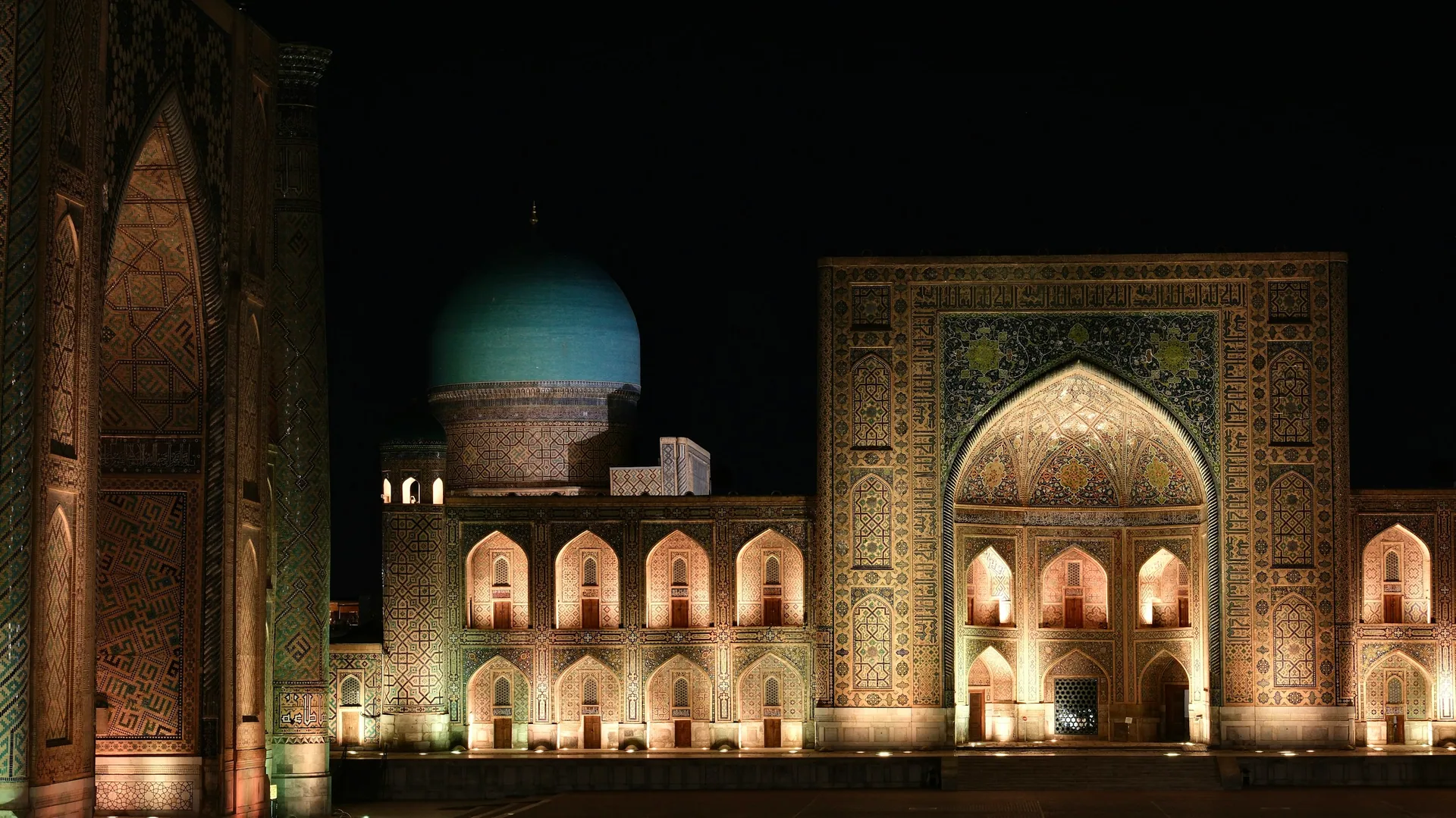 The illuminated madrasas of Registan Square at night in Samarkand, Uzbekistan